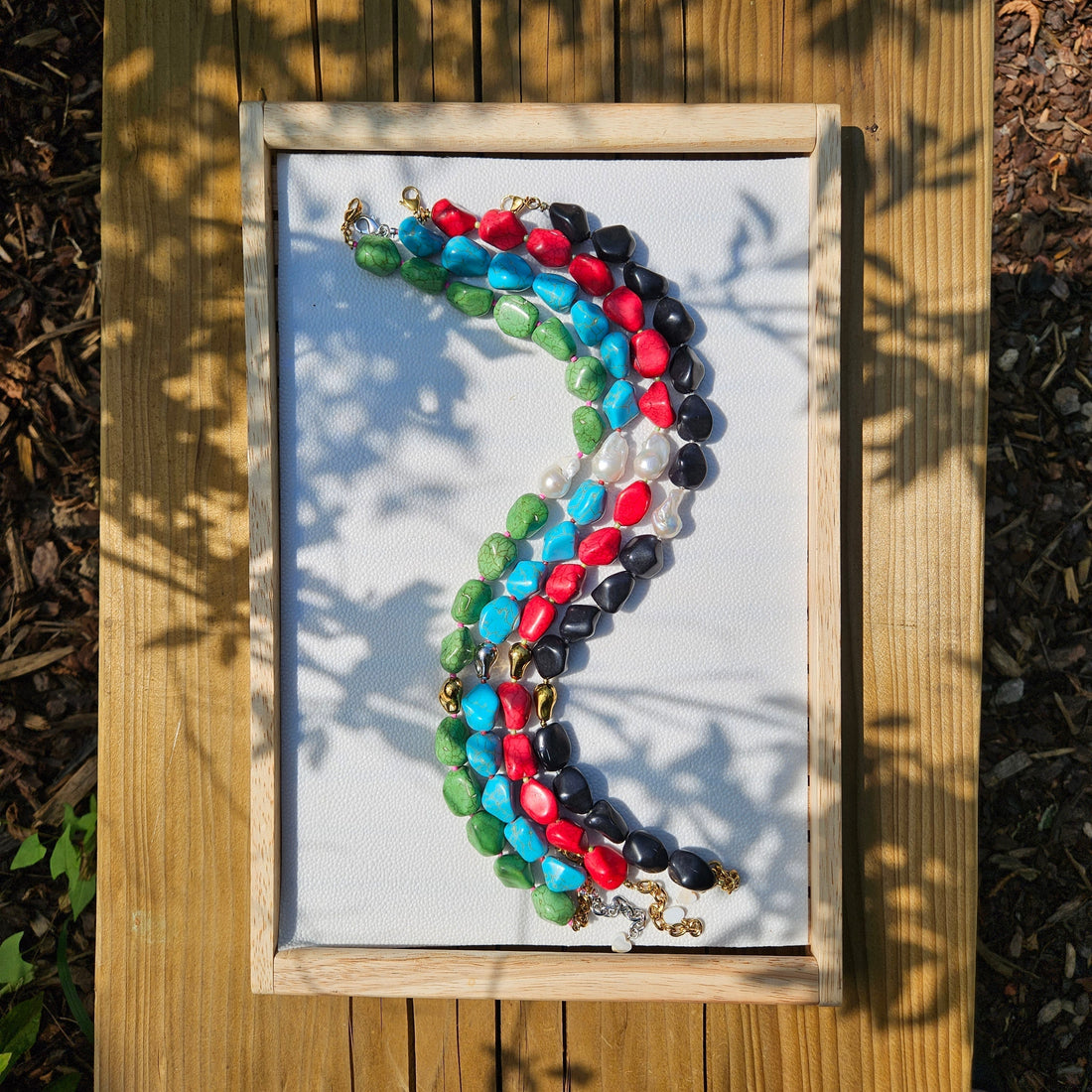 HANAÉ baroque pearl and colorful gemstone jewelry in natural sunlight 