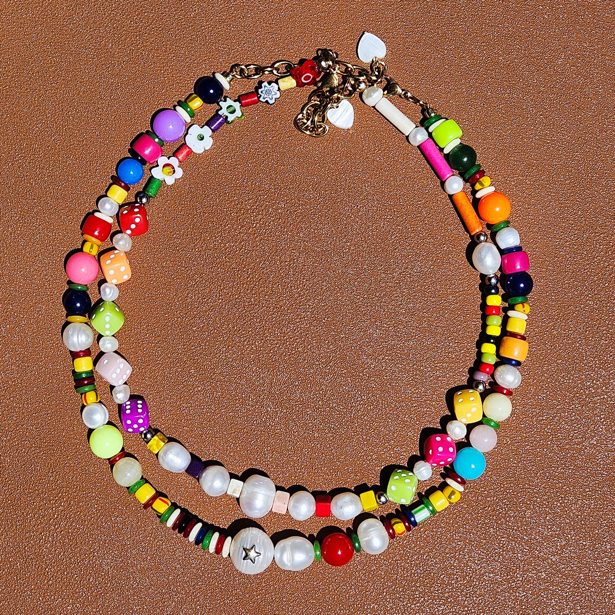 HANAÉ Playful Mix Beaded Necklace detail showing colorful acrylic, glass and resin beads, freshwater pearls, and mixed textures in a vibrant handcrafted design.