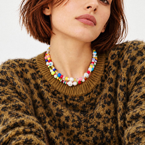 HANAÉ Playful Mix Beaded Necklace featuring colorful mixed beads and freshwater pearls, styled with a brown leopard print sweater for a bold fall and winter look.