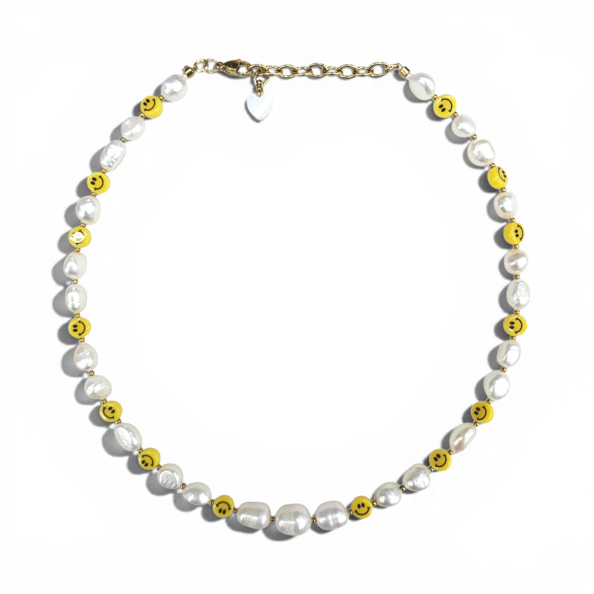 HANAÉ Smile Pearl Necklace featuring white freshwater pearls and yellow smiley face beads with gold-tone accents on a white background.
